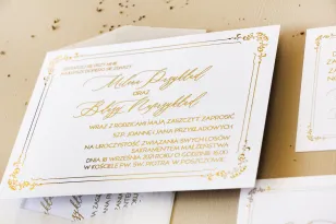 Minimalistyczne zaproszenia ślubne w białym kolorze ze złoceniami. Zaproszenia ślubne z ozdobną ramką