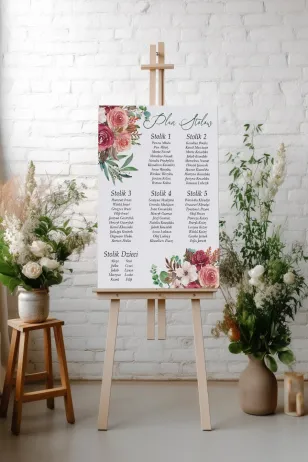 Hochzeitstischplan mit rosa Blumenstrauß und grünen Zweigen