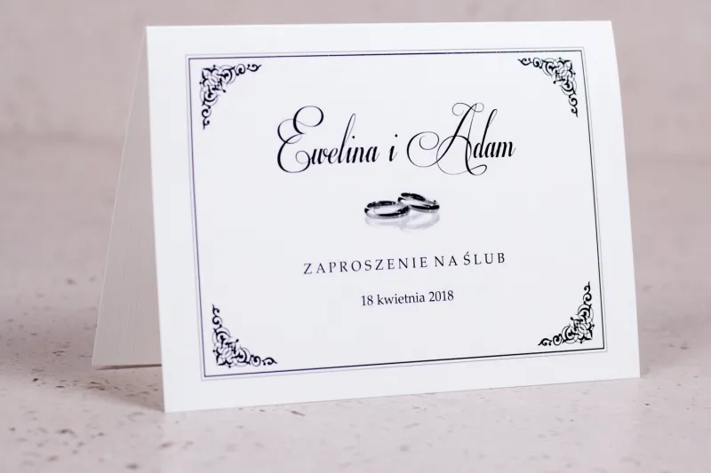 Zaproszenia ślubne Arte - Elegancki wzór z delikatną ramką i motywem obrączek Zaproszenia ślubne Arte - Elegancki wzór z delikatną ramką i motywem obrączek