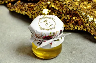 Glas Honig - ein süßes Dankeschön an die Hochzeitsgäste. Mütze mit vergoldeten Initialen.