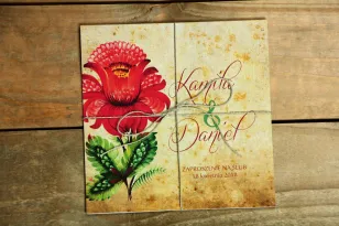 Ludowe zaproszenia ślubne z folklorystyczną kwiatową grafiką.