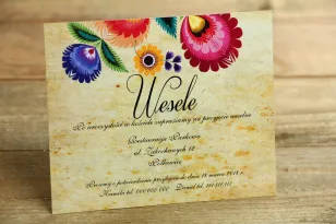 Ticket für eine Hochzeitseinladung - Folk. Grafik mit einem Ausschnitt von Łowicz. Eine breite Farbpalette unterstreicht den fol