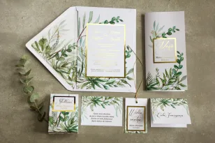 Zaproszenia ślubne w stylu glamour z botanicznym motywem greenery – zielone gałązki w otoczeniu złotej ramki oraz tekstu