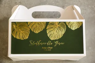 Vergoldete Hochzeitstortenschachtel im Glamour-Stil. Eine elegante Kombination aus Grün und vergoldeten Monstera-Blättern
