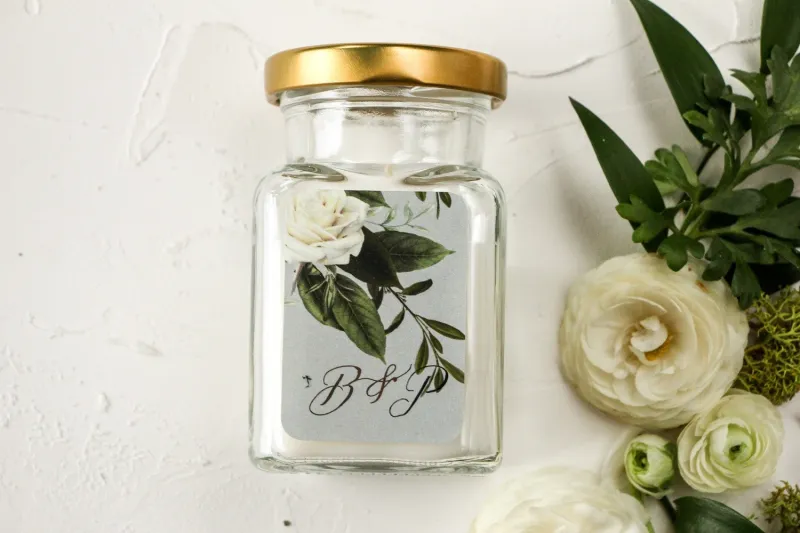 Świeczki - podziękowania dla gości weselnych. Etykieta z białymi różami w stylu glamour ze srebrnym tekstem