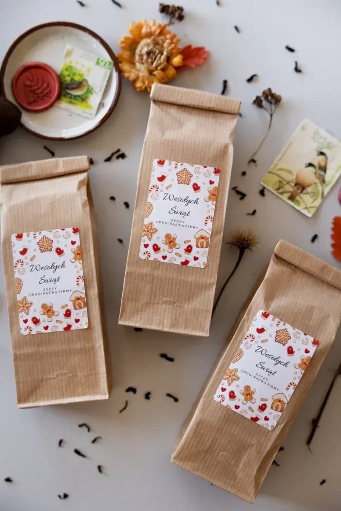 Tea in a kraft bag with a label featuring gingerbread men, hearts, and houses