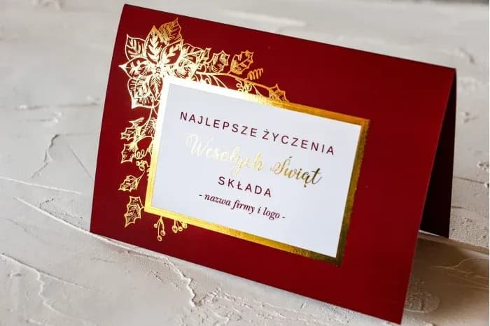 Personalizowana kartka bożonarodzeniowa z logo firmy i elegancką złotą ramką.