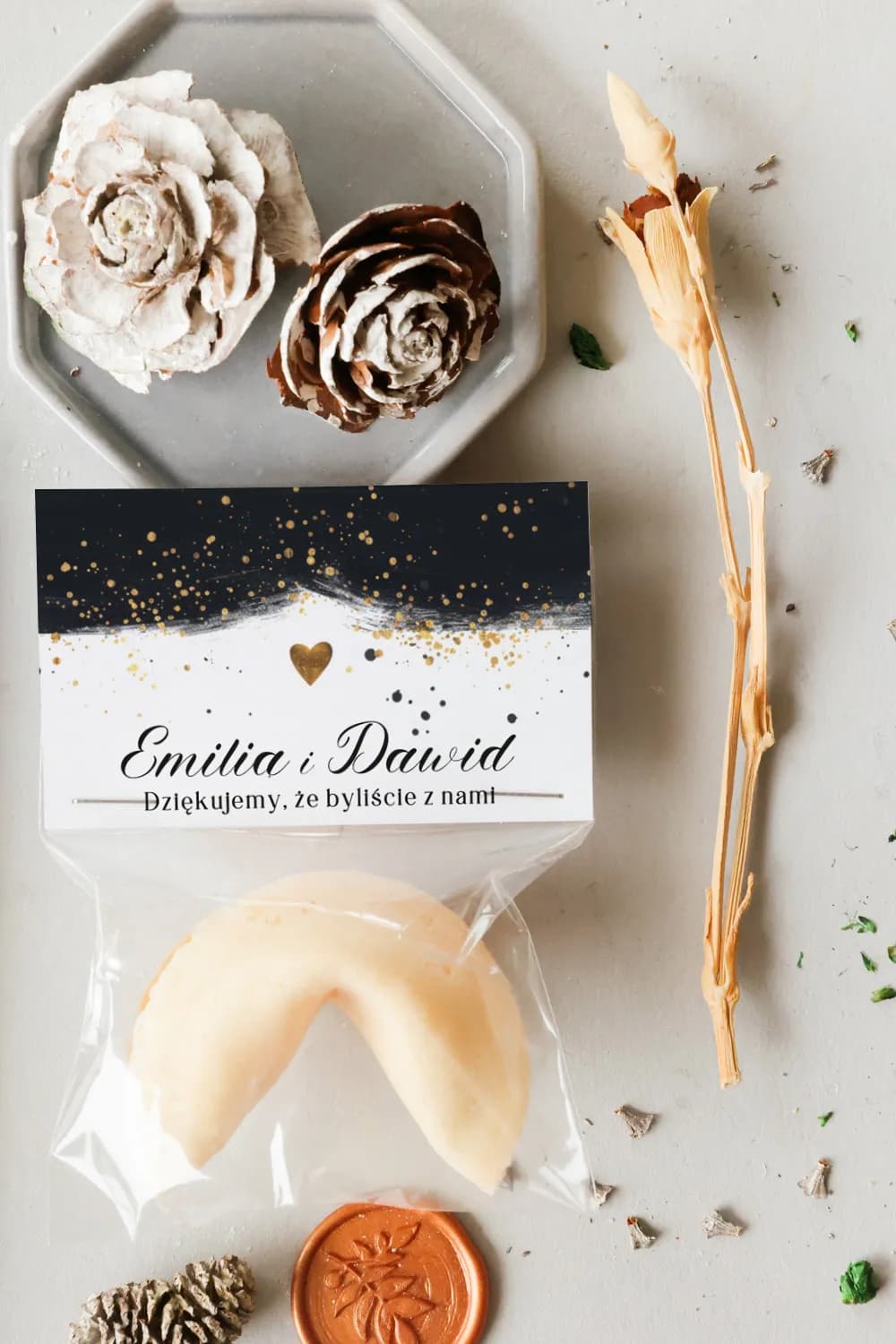 Black and gold fortune cookie in luxury packaging