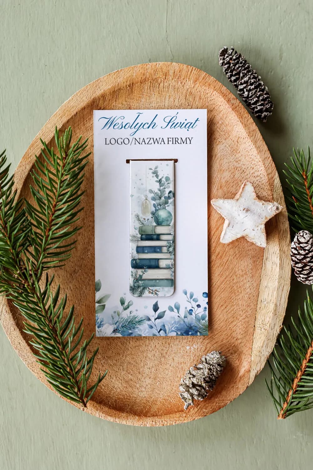 Festive magnetic bookmark with space for company logo. Artwork features a stack of blue and green books.