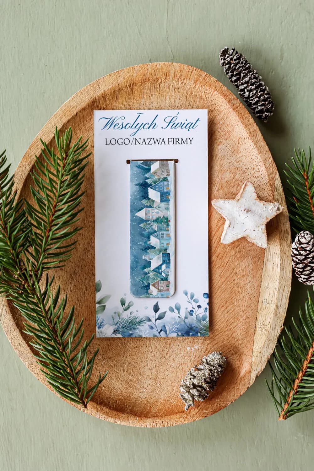 Elegant corporate Christmas gift – magnetic bookmark with winter landscape as a practical promotional gadget.