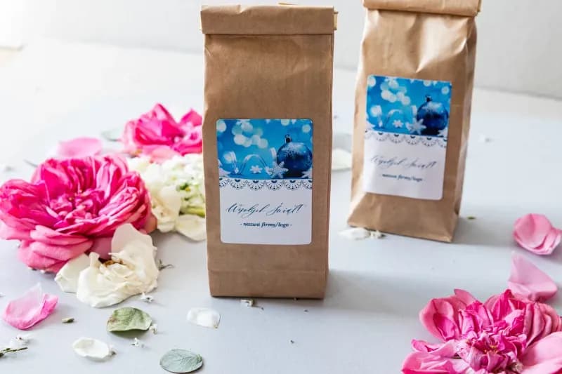 Black tea with company logo in a paper bag, elegant label with winter graphics, gift for clients and employees 50g