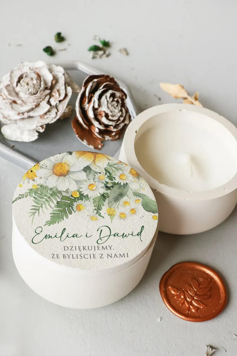 Personalized soy candle in a white gypsum container as a wedding favour for guests